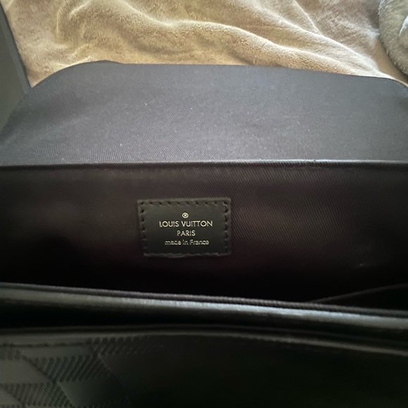 This is my black Louis Vuitton messenger bag, wore it one time perfectly good. - Picture 3 of 9